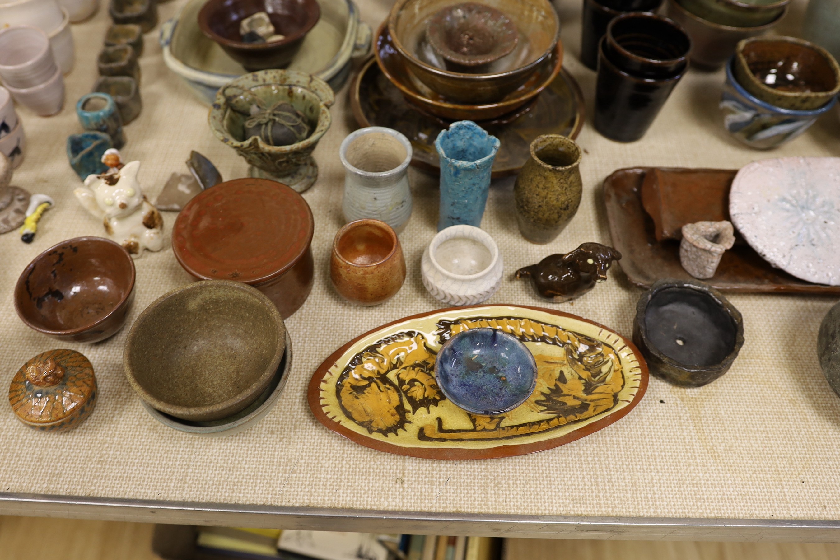 A large quantity of Susan Threadgold tall pottery bottle vase, eggcups, bowls, plates, vases etc, bottle vase 54cms high.